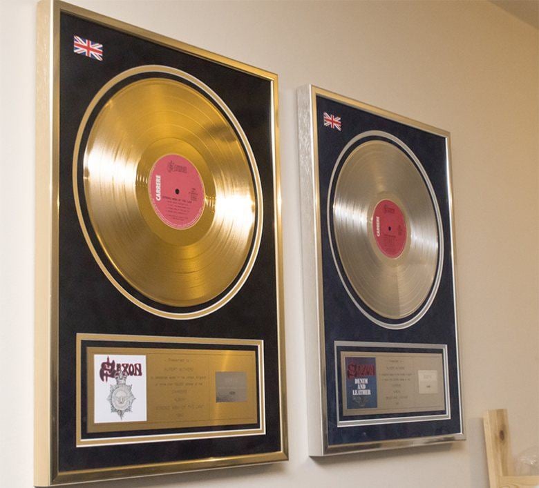 Framed gold and silver disc awards from Rupert Withers’ music management work